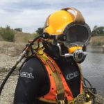 Diver preparing to rig vehicle for removal.