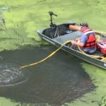 Tending diver as he rigs vehicle for removal.