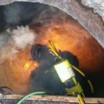 Diver burning old steel pipe